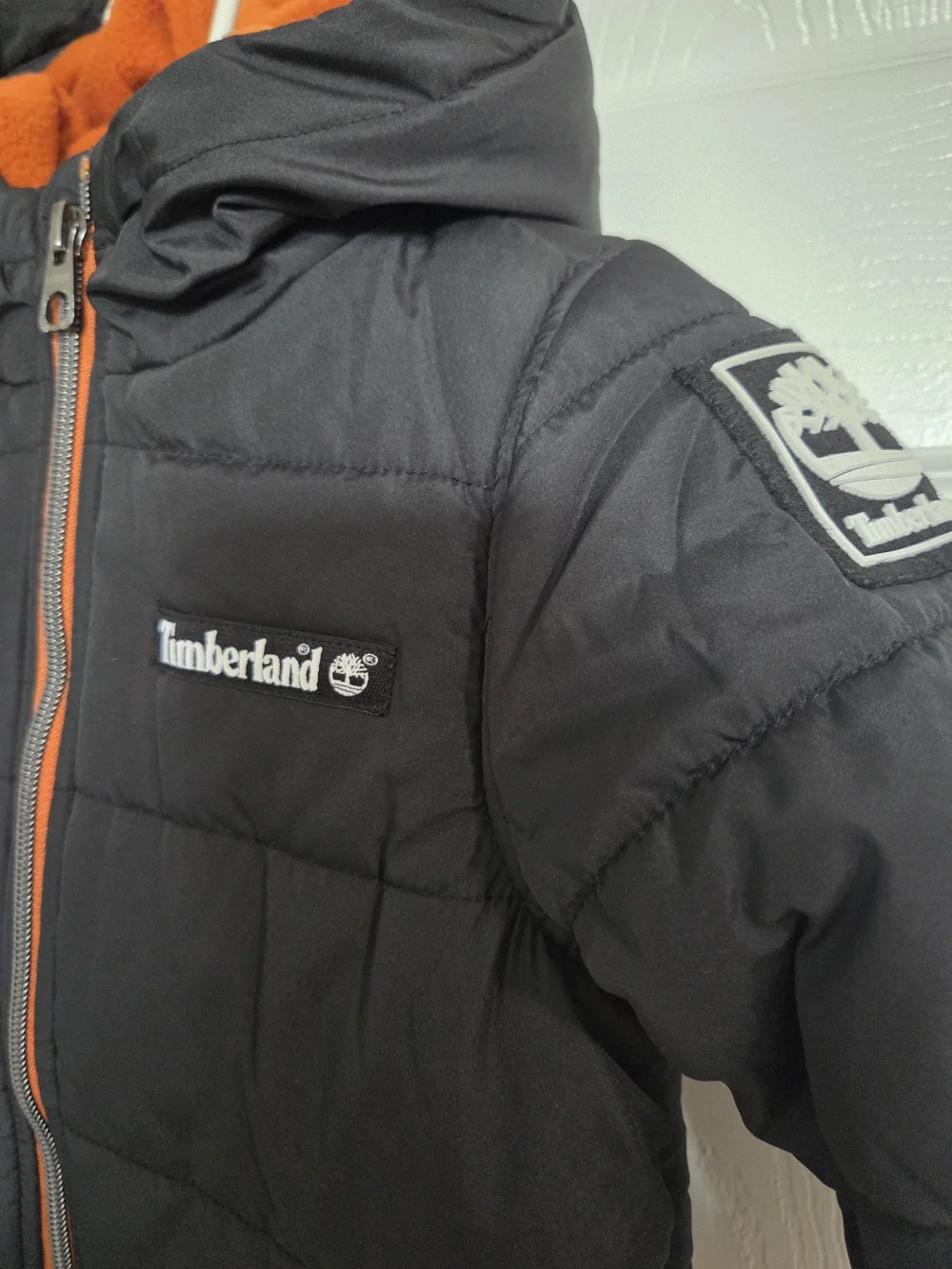 Timberland Kids' Black Puffer Jacket with Orange Lining